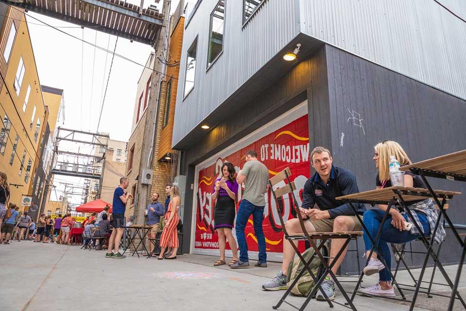 People talking in Roberts Alley in Fargo